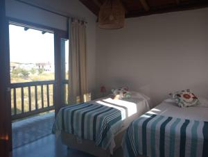 Ένα ή περισσότερα κρεβάτια σε δωμάτιο στο Casa D´Alicia