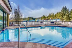 a swimming pool at a resort at 4 Bedroom Ski In, Ski Out Mountain Vacation Rental Located Next To Historic Main Street In Downtown Breckenridge in Breckenridge