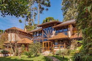 an exterior view of a house at Pousada Boutique Vilage de Minas in Monte Verde +37 photos