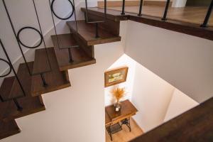 an overhead view of a staircase with wooden treads at 188 Apartments - Estrelícia - pool and balcony in Cascais