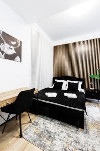 Gulta vai gultas numurā naktsmītnē Ratusz Exclusive Apartment- Apartament przy Ratuszu