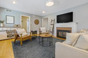 a living room with a couch and a fireplace at Victory On Vine in Paso Robles