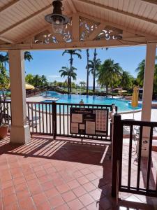 a view of a swimming pool at a resort at Studio RDC La Désirade Martinique accès direct plage in Sainte-Luce