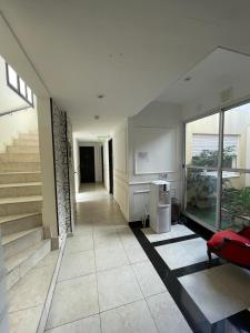 a living room with a staircase in a house at Lolo Hotel Boutique in Mar del Plata