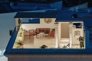 a model of a house with a living room at LE MAIOLICHE - Apulian B&B in Grottaglie