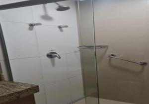 a shower with a glass door in a bathroom at Quality Hotel & Suites Brasília in Brasília