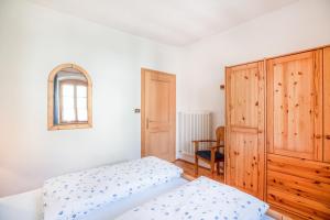 Postel nebo postele na pokoji v ubytování Pausahof - Apartment Abendsonne