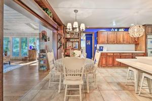 a dining room and kitchen with a table and chairs at Dobson Getaway with Private Pool and Game Room! in Dobson