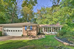 a brick house with a white garage at Dobson Getaway with Private Pool and Game Room! in Dobson