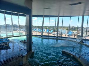 a swimming pool in a building with a water slide at Condominios W Nordelta Bahia,Tigre,Piscina con arancel, Parking in Tigre