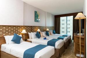 Postel nebo postele na pokoji v ubytování Sunrise Ajyad Hotel