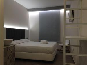 Postel nebo postele na pokoji v ubytování HOSTAL LETTO DAL MARE