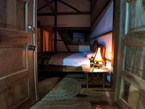 Voodi või voodid majutusasutuse Hostal Olmito Canoa toas