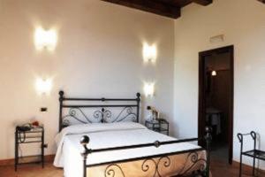 Postel nebo postele na pokoji v ubytování Hotel Dei Templi
