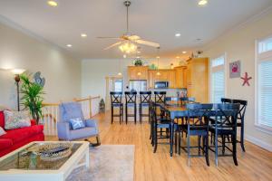 a living room with a table and chairs and a kitchen at Your Turn in Surf City