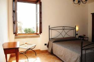 Postel nebo postele na pokoji v ubytování Hotel Dei Templi