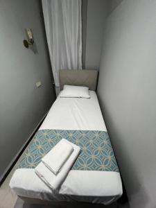 Postel nebo postele na pokoji v ubytování GRAND Deniz Hotel