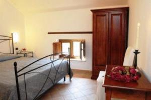 Postel nebo postele na pokoji v ubytování Hotel Dei Templi