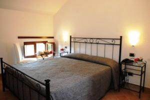 Postel nebo postele na pokoji v ubytování Hotel Dei Templi