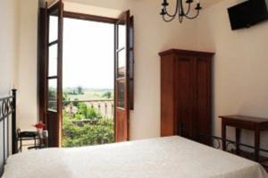 Postel nebo postele na pokoji v ubytování Hotel Dei Templi