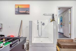 a white bathroom with a shower and a sink at Miss Olena in Seal Rock +58 photos