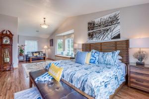 a bedroom with a bed and a couch at Miss Olena in Seal Rock