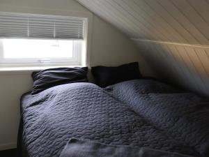 מיטה או מיטות בחדר ב-Holiday home HALMSTAD VI