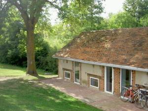 a house with bikes parked outside of it at Gîte Châtel-de-Neuvre, 2 pièces, 3 personnes - FR-1-489-22 in Châtel-de-Neuvre