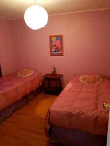 Ein Bett oder Betten in einem Zimmer der Unterkunft Vacaciones El Quisco