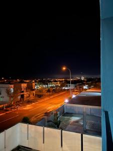 a city street at night with a street light at 4 bedrooms (private bathroom) Perdana Hill Villa in Lahad Datu
