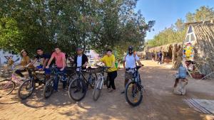 a group of people standing with their bikes at Elrayga Camp Dahab in Dahab