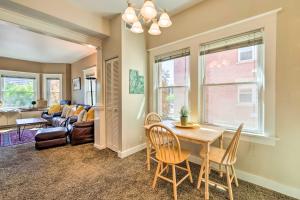 a living room with a table and chairs and a couch at Salt Lake City Condo Less Than 28 Mi to Ski Resort! in Salt Lake City