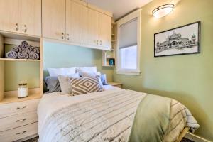a bedroom with a large bed and a window at Salt Lake City Condo Less Than 28 Mi to Ski Resort! in Salt Lake City