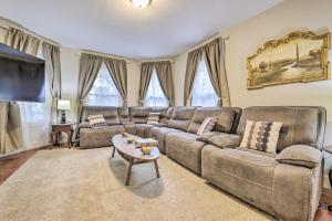 a living room with a couch and a table at Cozy Springfield Apartment, Close to Parks! in Springfield