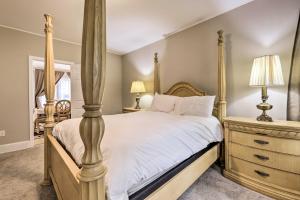 a bedroom with a four poster bed and a dresser at Cozy Springfield Apartment, Close to Parks! in Springfield