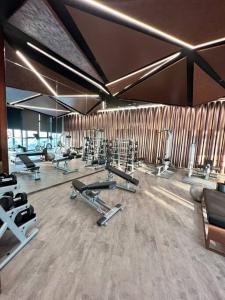 a gym with a lot of exercise equipment in it at Secret Gem Sea-View King Size EDGE Central Pattaya in Pattaya Central