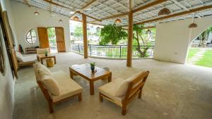 a large living room with a table and chairs at Bavi Myan Maison in Yên Cư