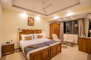 Voodi või voodid majutusasutuse De Mandarin Beach Resort Suites & Villas, Candolim toas