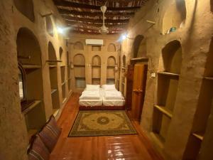 Letto o letti in una camera di Bait Aljabal Hospitality Inn