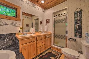a bathroom with a shower and two sinks and a toilet at Dog-Friendly Gaylord Retreat Less Than 8 Mi to Town! in Gaylord +36 photos