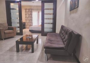Area soggiorno di Grand Bay Suites