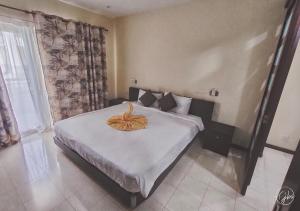 Letto o letti in una camera di Grand Bay Suites