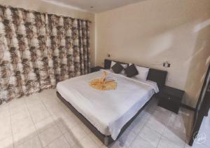 Letto o letti in una camera di Grand Bay Suites
