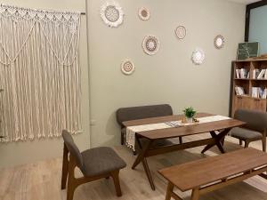 a dining room with a table and chairs at 澄居行旅 in Tainan