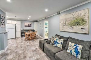 a living room with a couch and a kitchen at Walk to Ocean Condo with Community Perks on HHI in Hilton Head Island