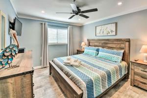 a bedroom with a bed and a ceiling fan at Walk to Ocean Condo with Community Perks on HHI in Hilton Head Island +22 photos