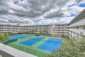 an image of two tennis courts in a building at Walk to Ocean Condo with Community Perks on HHI in Hilton Head Island