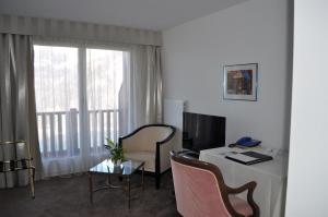 TV a/nebo společenská místnost v ubytování Seminar- & Erlebnishotel RömerTurm