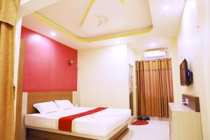 Postel nebo postele na pokoji v ubytování HOTEL PERFECT PLAZA