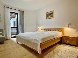Postel nebo postele na pokoji v ubytování Apartment Harmony - Tatranska Lomnica, Javorinka